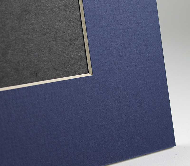 Beveled edge detail on blue mat board frame