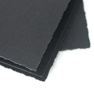 Linen weave paper black with deckle edge detail.