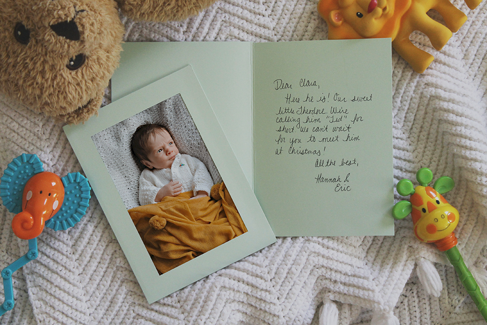 Mint green photo insert birth announcement with handwritten message