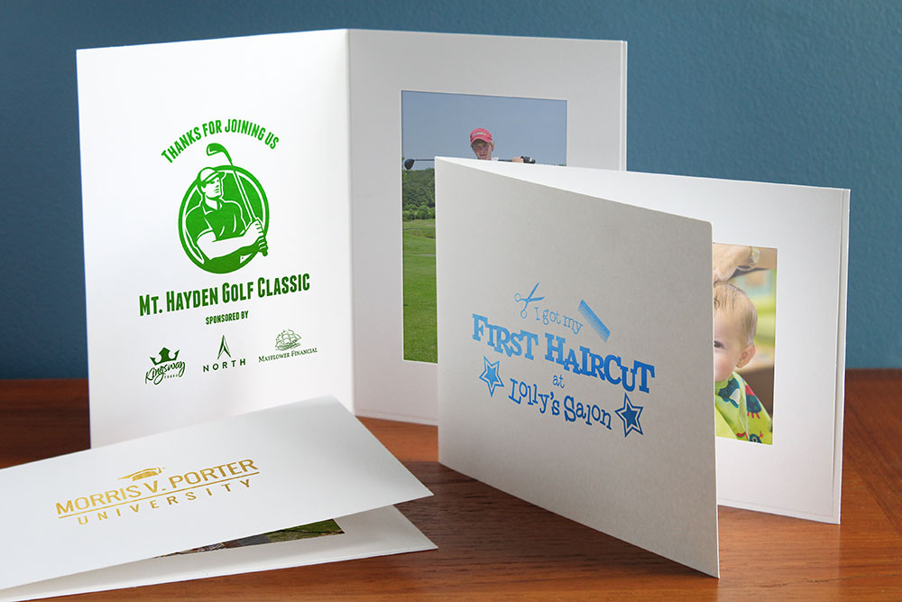 White 4 by 6 photo folders with foil stamped logo imprints