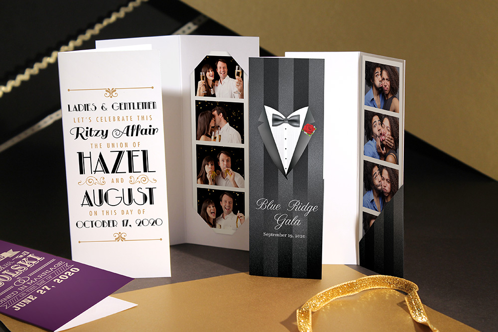 Three 2 by 6 photo booth folders printed with event details