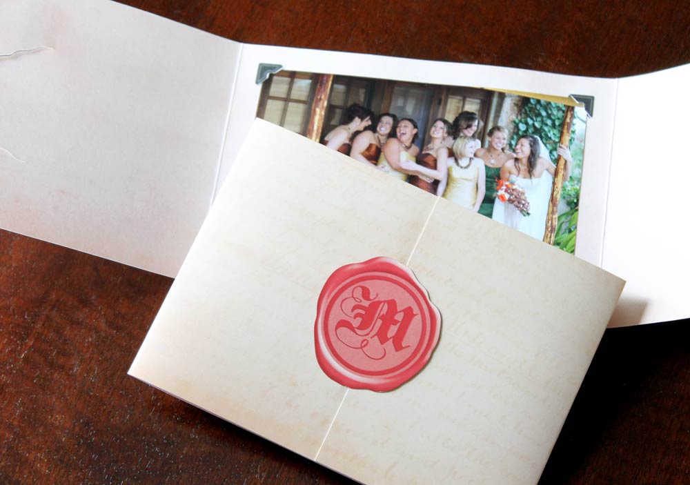 Gatefold-style photo folder with a wax-seal printed design