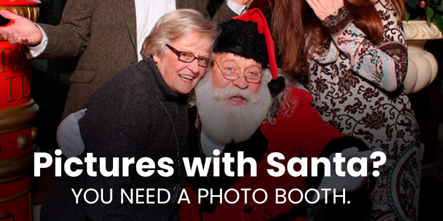Santa in a photo booth with happy people