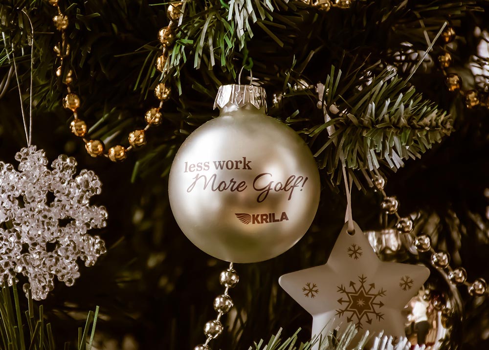 Christmas ornament with text that reads: less work more golf! 