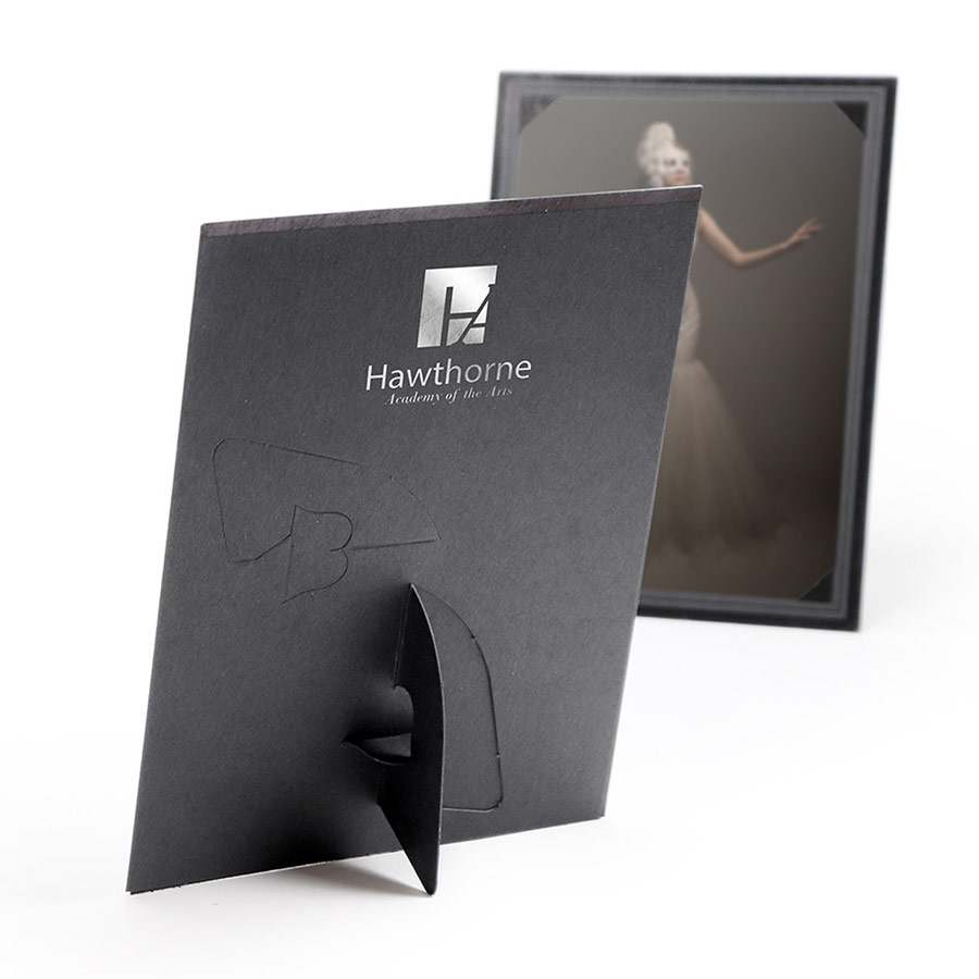 Black paper frame with pop-out easels for horizontal or vertical display. Frame has na silver foil logo imprint on the back.