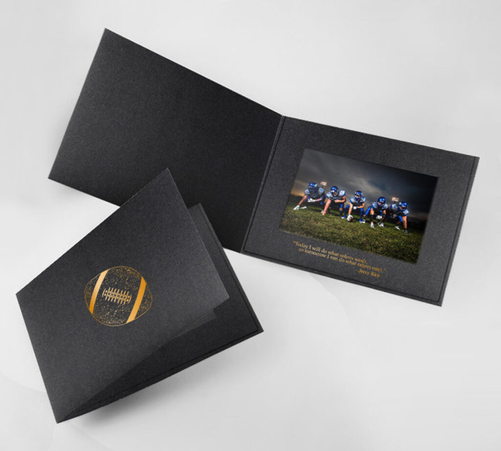 Black football photo folder with copper foil football design on the front cover and a motivational quote on the window frame border