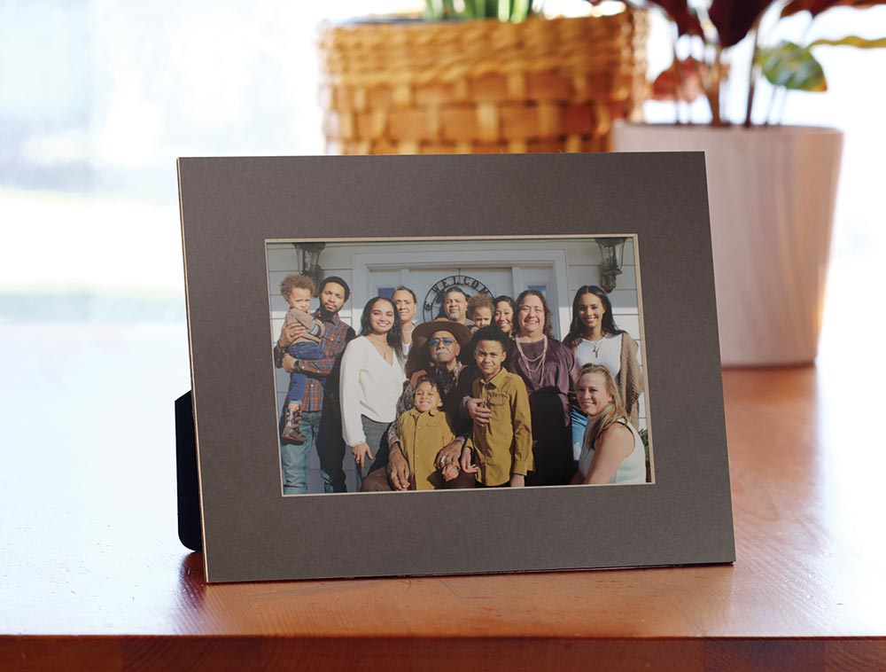 Gray mat board frame holds a family photo