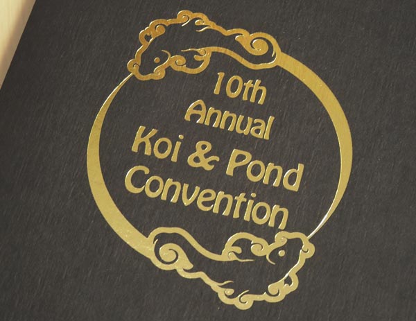 The convention imprint is on a black portrait folder in metallic gold foil