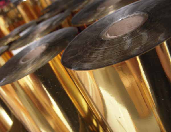 Rolls of metallic gold foil