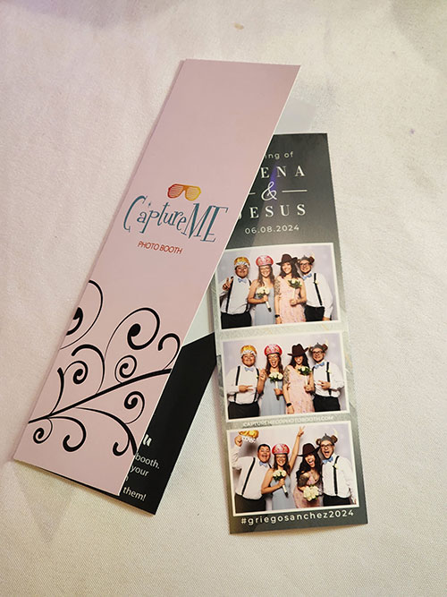 Custom photo booth picture strip folder Studio Style made with the CaptureME logo printed on the front cover.