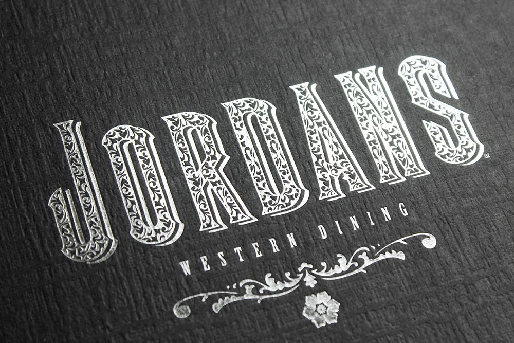 Silver foil stamping on a black portrait folder